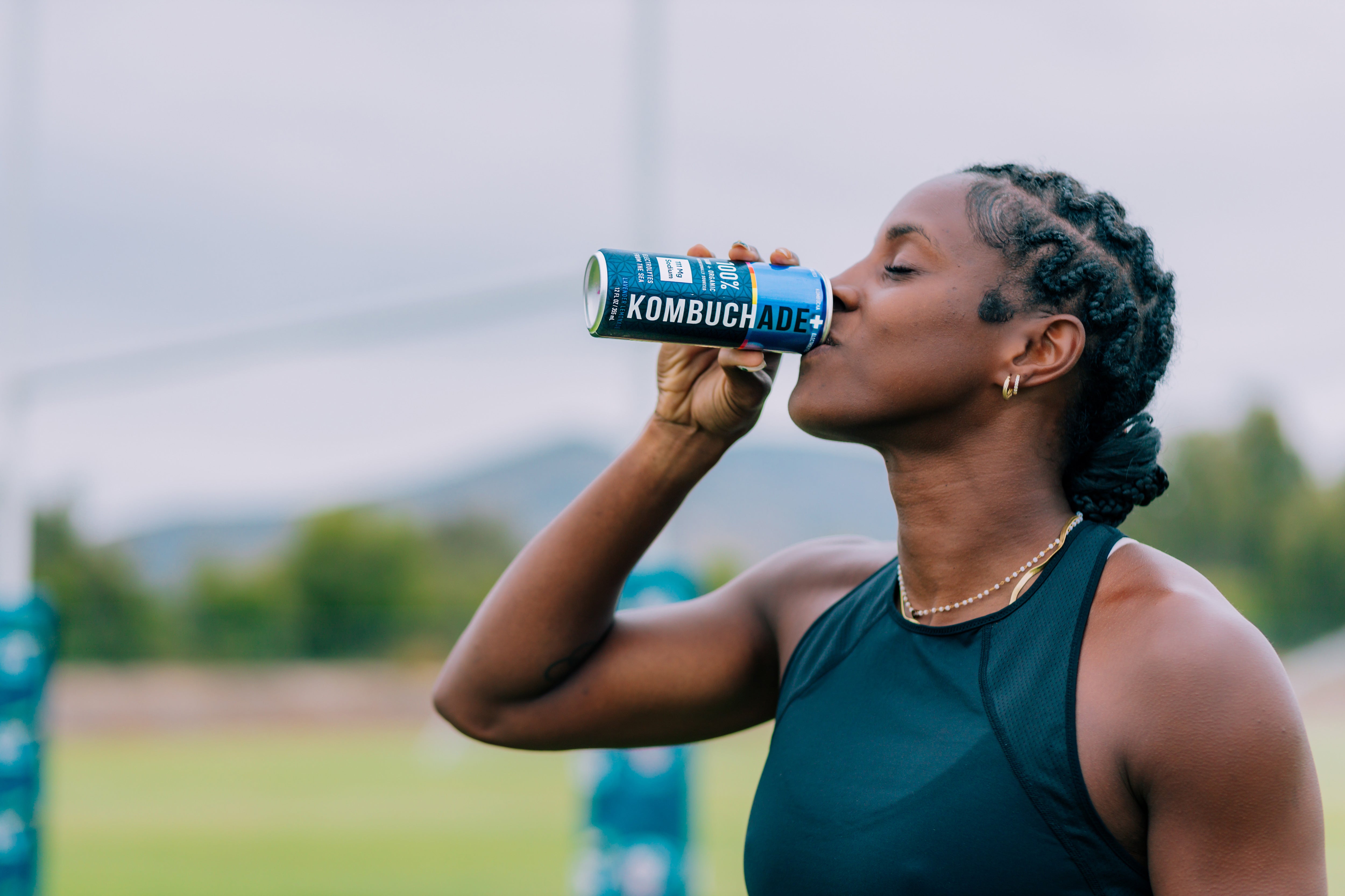Naya Tapper USA rugby team athlete drinking lavender lemonade Kombuchade on rugby field