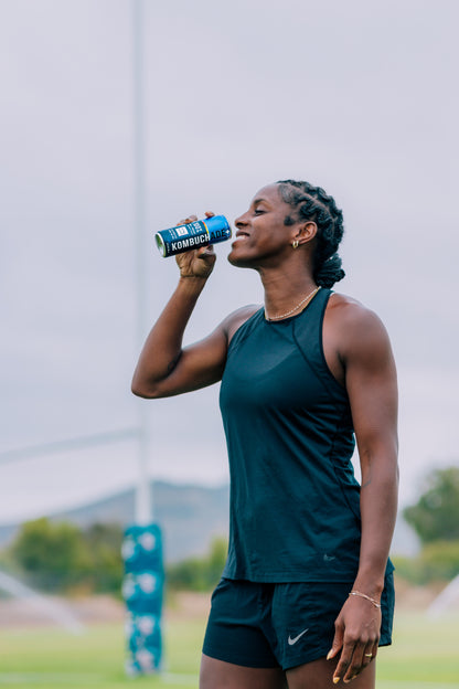 Naya Tapper USA rugby team athlete smiling while drinking Lavender Lemonade Kombuchade